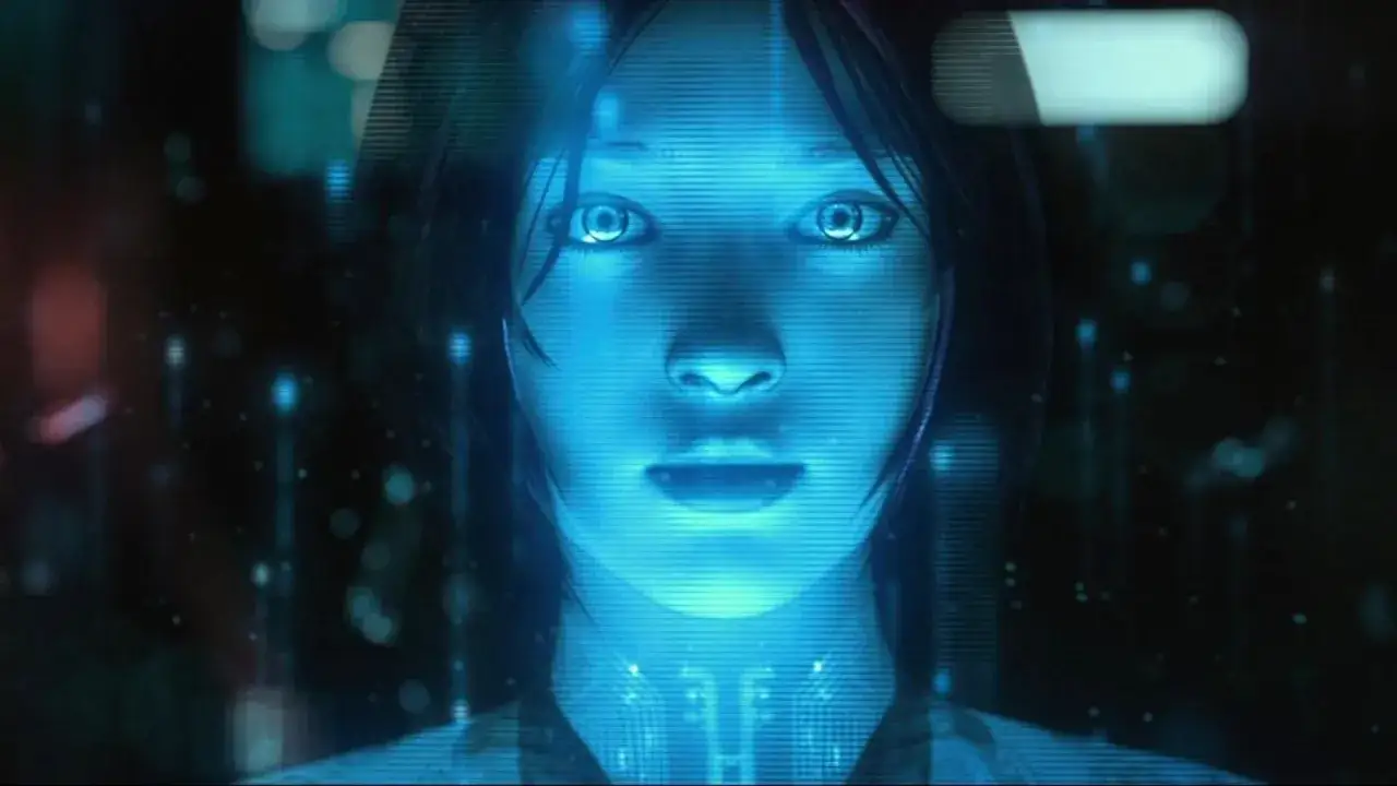 Niebieska, holograficzna twarz kobiety, przypominająca postać z gry Halo. Czy to jest właśnie Cortana?